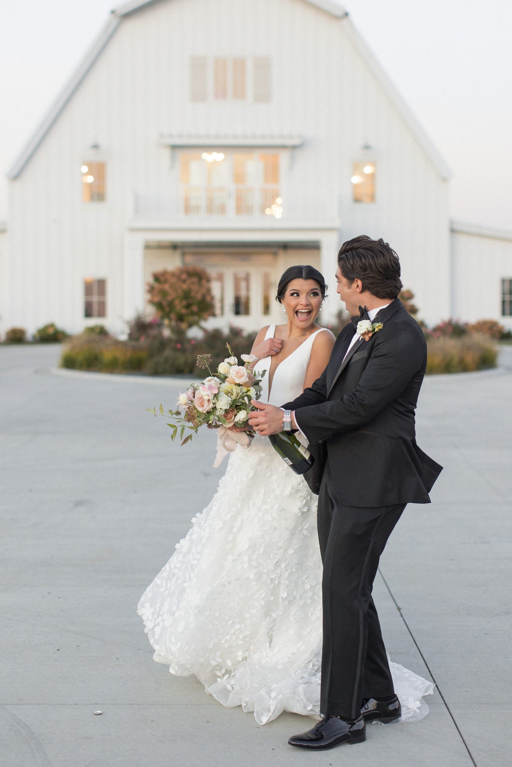 Bride and groom pop champagne to celebrate at providence vineyard