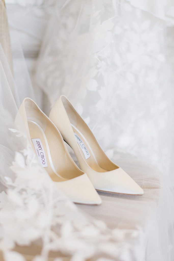 Jimmy Choo satin cream bridal shoes on display