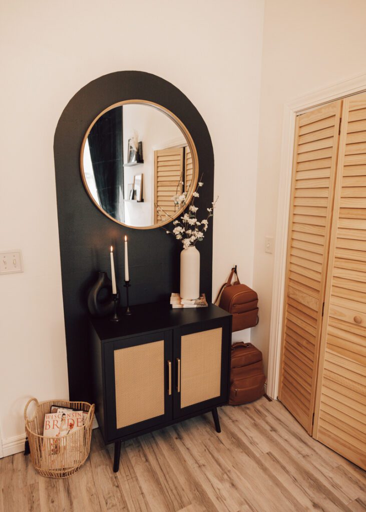 Arch design with storage and mirror for an in home office. 