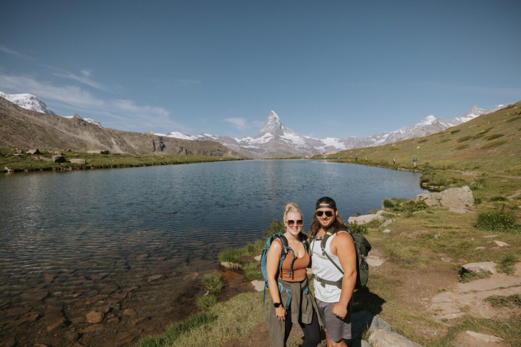 Couple in front of lake with Matterhorn.